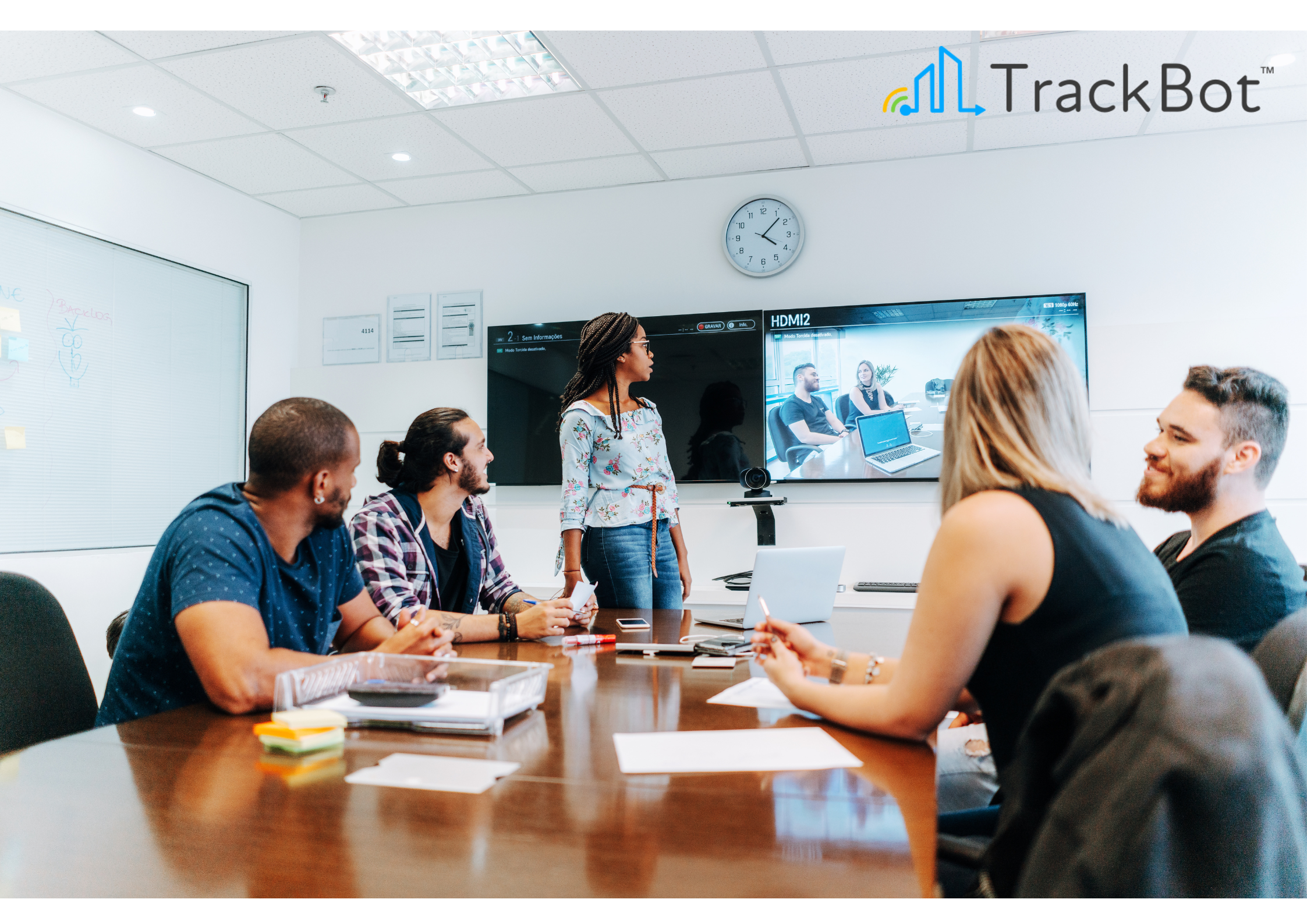 A modern conference room with video conferencing hardware.